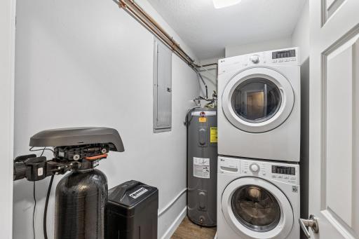 In unit laundry, with storage behind door.