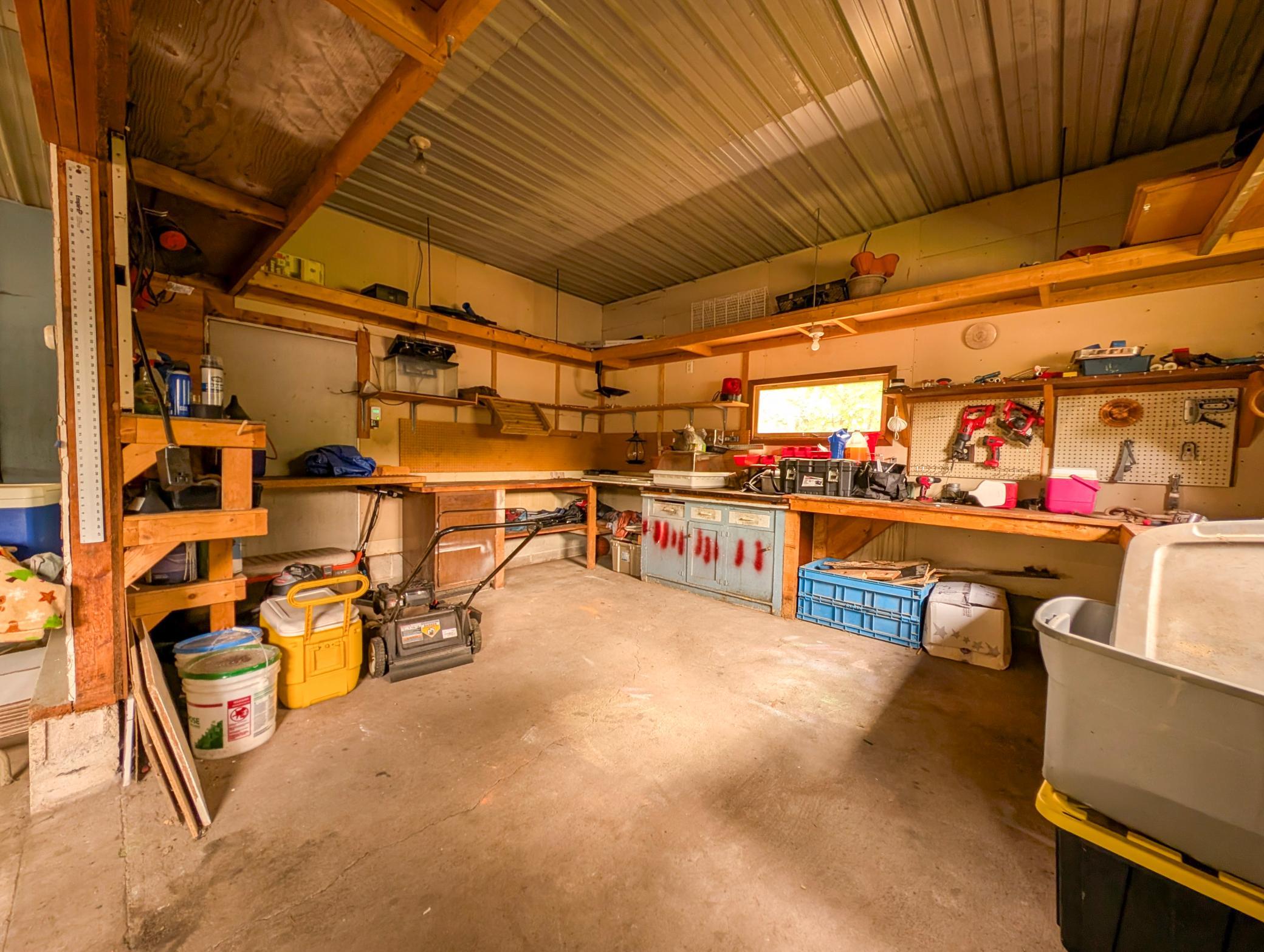 The heated two-stall garage includes a bonus workshop space in back—perfect for hobbies, projects, or extra storage. Plus, a handy garden shed keeps your tools tucked away.