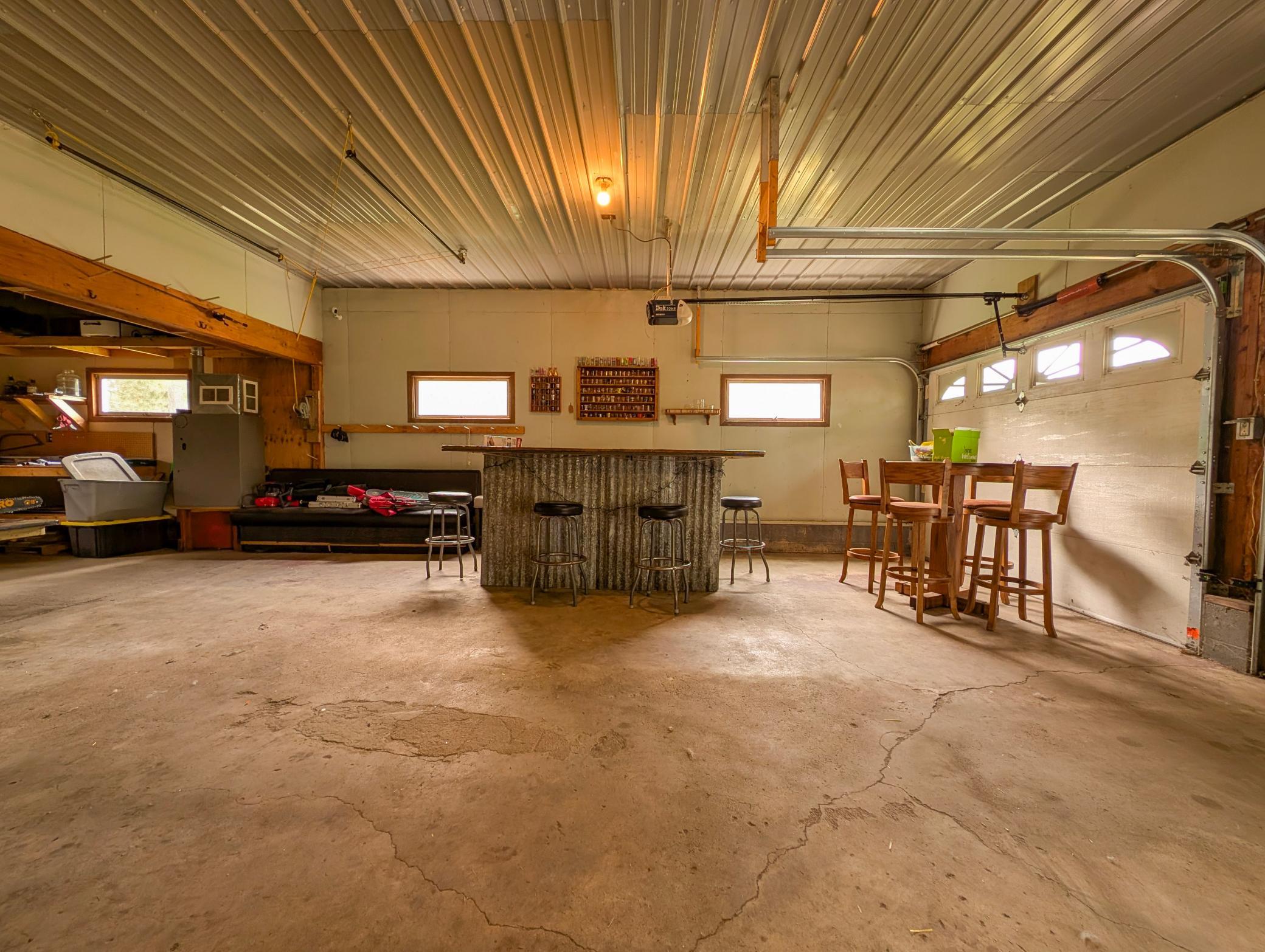 The heated two-stall garage includes a bonus workshop space in back—perfect for hobbies, projects, or extra storage. Plus, a handy garden shed keeps your tools tucked away.