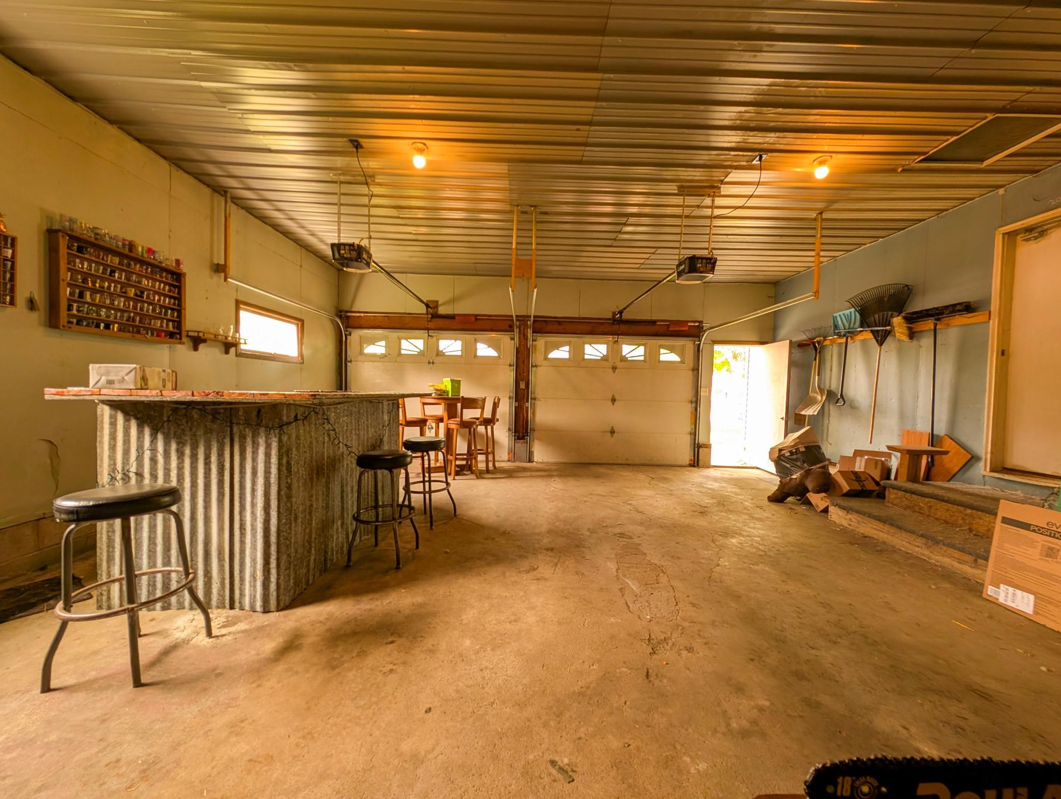 The heated two-stall garage includes a bonus workshop space in back—perfect for hobbies, projects, or extra storage. Plus, a handy garden shed keeps your tools tucked away.