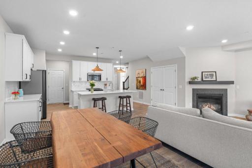 This wide-open main level brings it all together—gorgeous kitchen with center island, cozy living room with gas fireplace, and a spacious dining zone that flows effortlessly. The vibe? Clean, modern, and made for real life.
