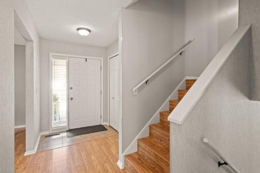 Inviting entryway for your guests with coat closet and space for a bench.