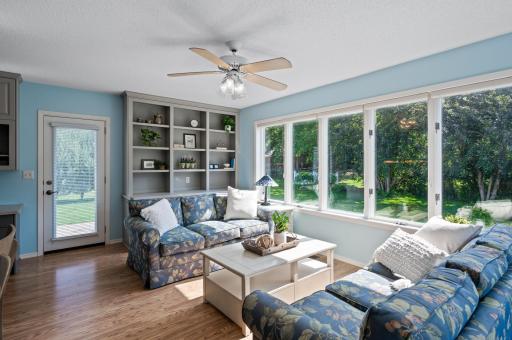 Sunroom overlooking this huge yard. Access to grilling on the deck or relaxing on the patio. Mature treed lot.