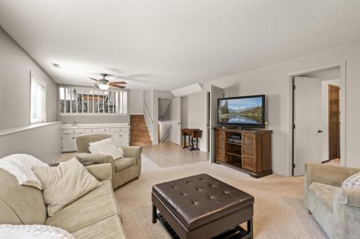 Lower 3rd level with wet bar, 4th bedroom plus a powder bathroom with look-out windows. Newer windows! Professionally cleaned carpets.