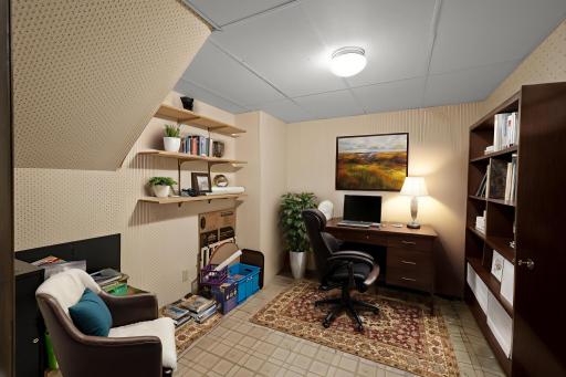 Your Harry Potter under the stairs office space! Home offers a ton of work from home areas. Opposite this room is the mechanical room, complete with two refrigerators to be included and a cedar closet space. Virtually staged.