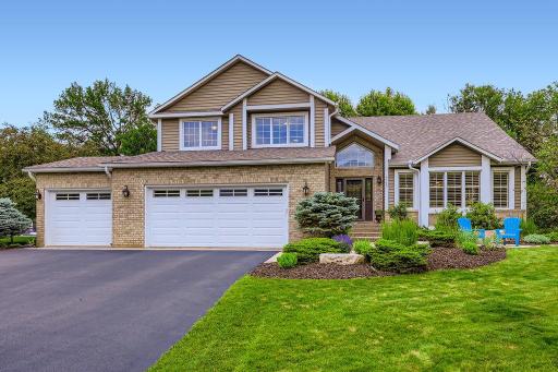 This one is a show stopper! 5 bedrooms, 4 baths & lovely mature trees on the private lot.