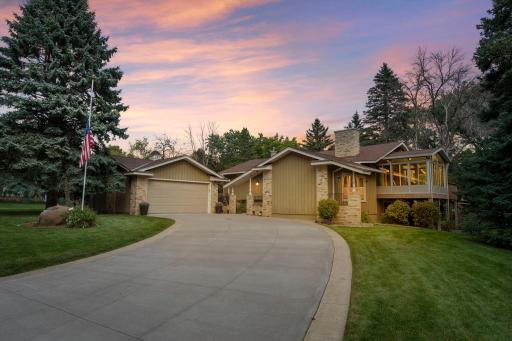 Welcome home to 5 Oaks Lane in beautiful Birchwood Village!