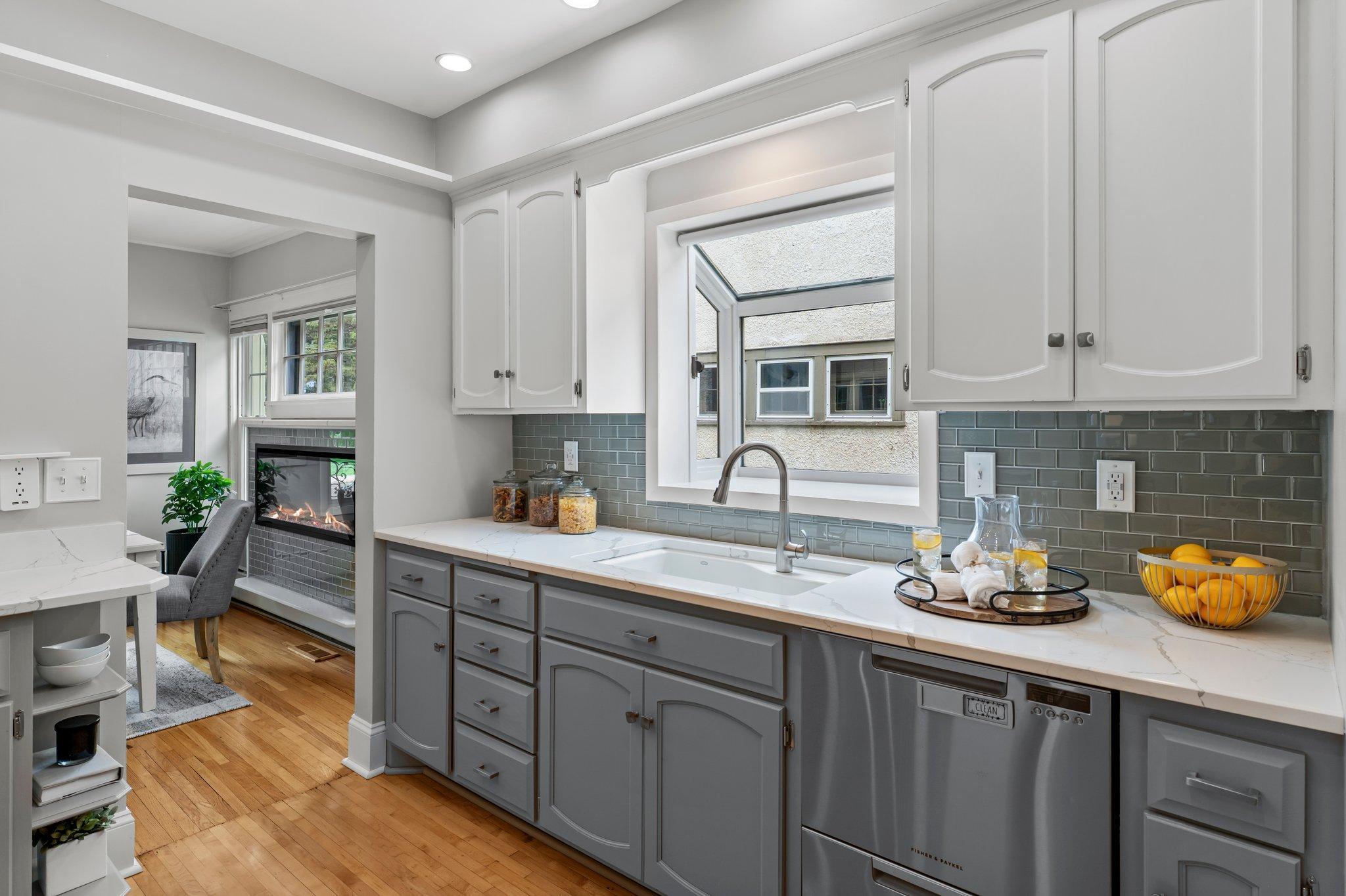 A lovely garden window above the sink fills the space with daylight.