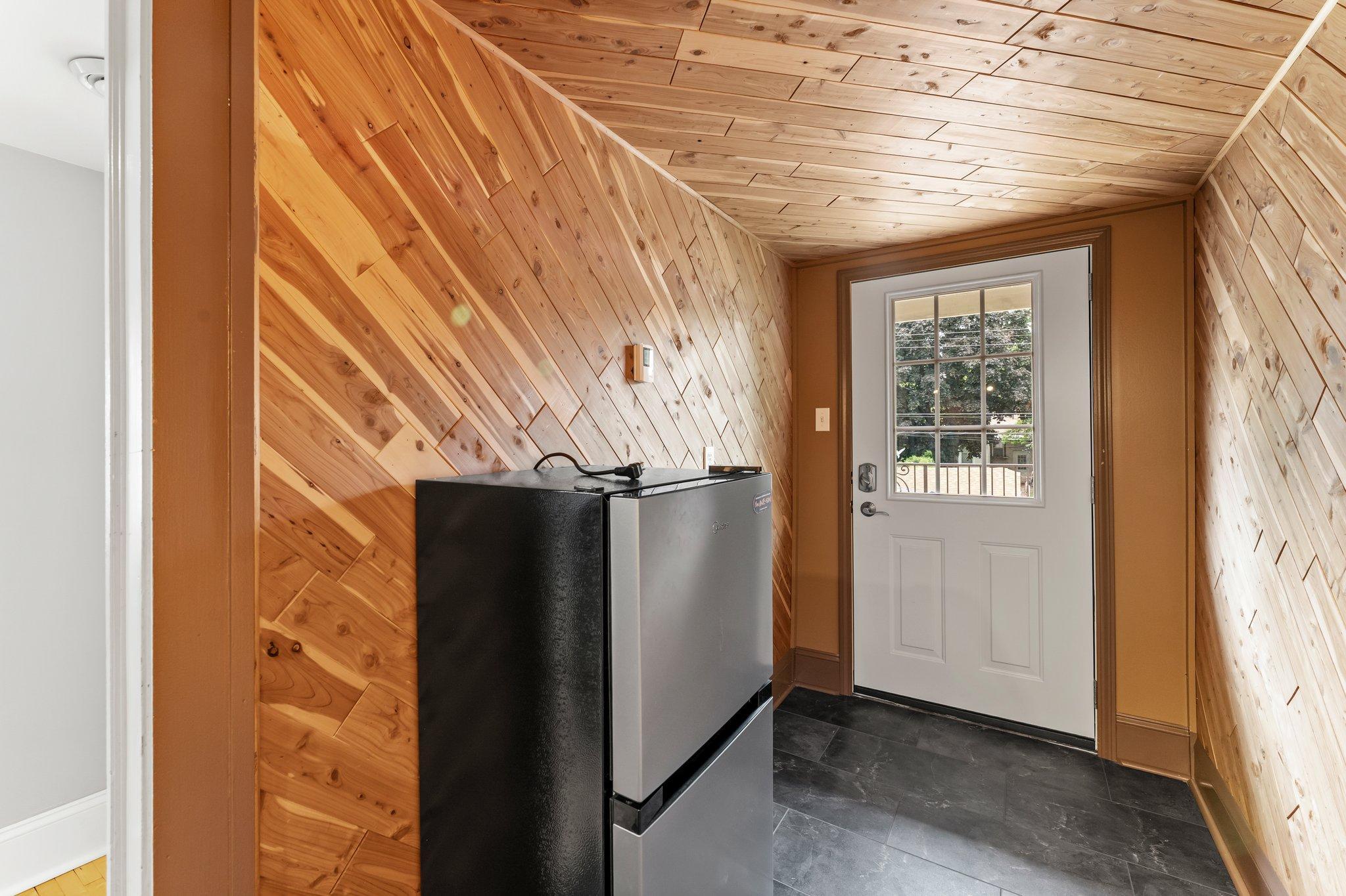 Just outside the bathroom is a cozy den area with heated tile floors.