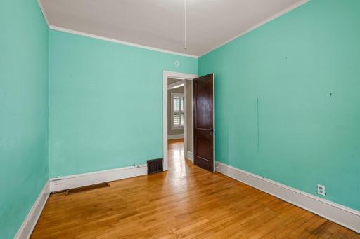 This third main-floor bedroom offers plenty of natural light, creating a bright and welcoming space.