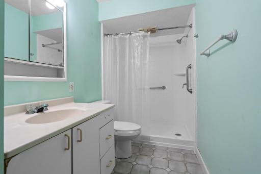 Three fourth bathroom conveniently located to serve all main-floor bedrooms and guests.