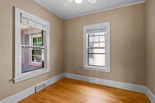 This well-appointed main-floor bedroom offers versatility and comfort, ideal for guests & family members.