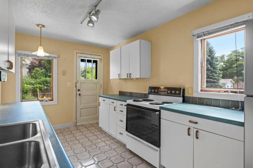 This main level kitchen features ample cabinetry and generous counter space.