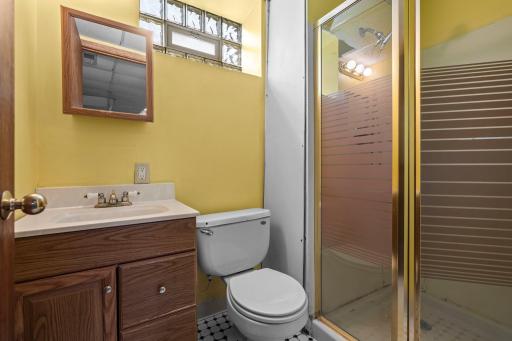 This convenient lower level bath features a walk-in shower, perfect for guests or daily use.