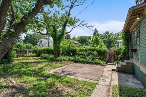 Private fenced-in backyard offers great potential for gardening, play, or entertaining.