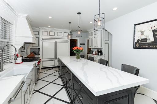 Double sub zero fridge & freezer, Quartz counter tops & heated tile floor
