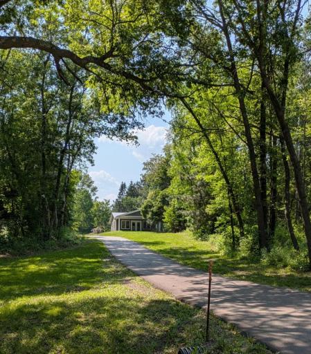 Welcome to your little slice of peace and quiet! Beautiful mature trees! The blacktop driveway makes maintenance a breeze!