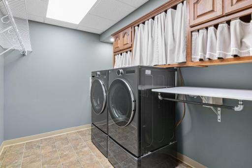 Lower level laundry room with utility sink. Make laundry a snap after a day on the lake.
