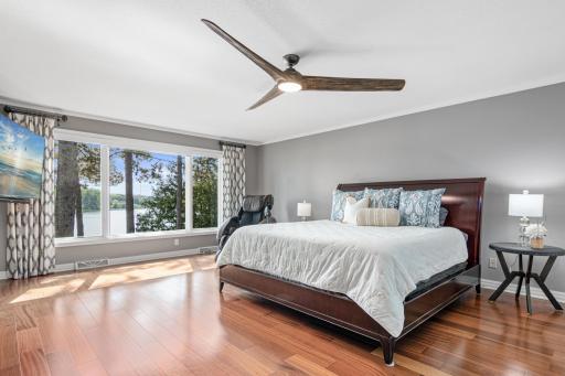 This huge, main floor, primary suite is where you will want to wake up to water views and fall asleep to the gentle sound of the breeze in this dreamy primary suite designed for total relaxation.
