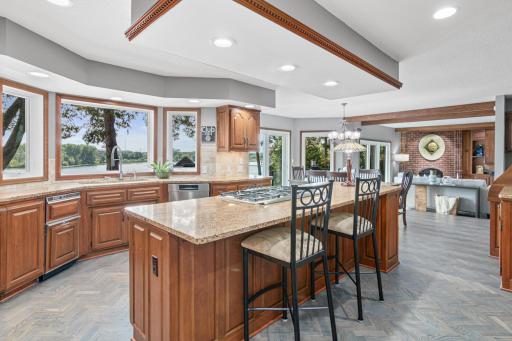 The kitchen itself is as functional as it is beautifulâfeaturing sleek countertops, stainless steel appliances, and plenty of prep space for group meals or casual snacks. Check out that view!