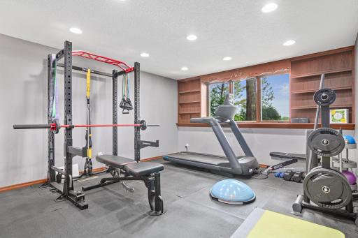 This is the other bedroom in the lower level being used as gym. Stay energized and inspired in your own private workout room with stunning lake views. No need for a gym membership when you combine the outdoor and indoor activities.