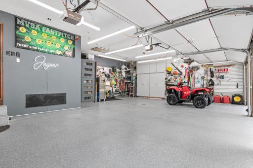 Huge, heat, insulated and epoxied 3-car garage with floor drain.