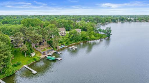 Surrounded by tall trees, the lake feels peaceful yet aliveâwhere loons call in the distance, fish ripple the surface, and paddleboards glide silently across the water.
