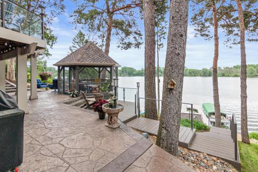 Stamped concrete patio, gazebo, boat house... this outside oasis is the perfect place to entertain.