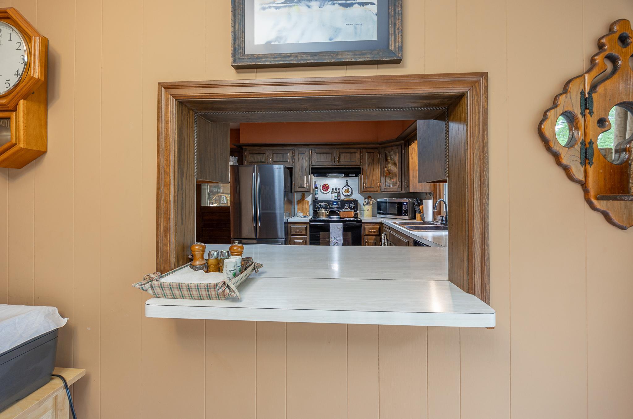 Quaint pass through window from kitchen to dining area.