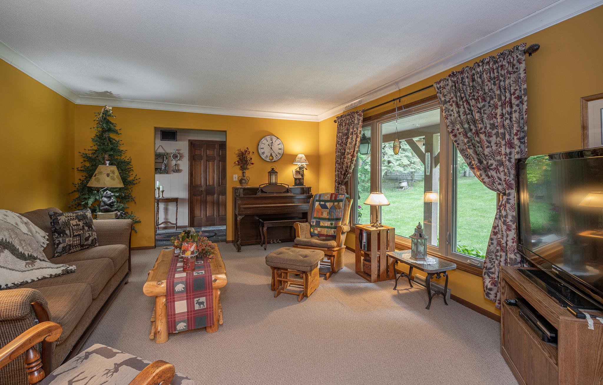 Family room with large window overlooking the back yard.