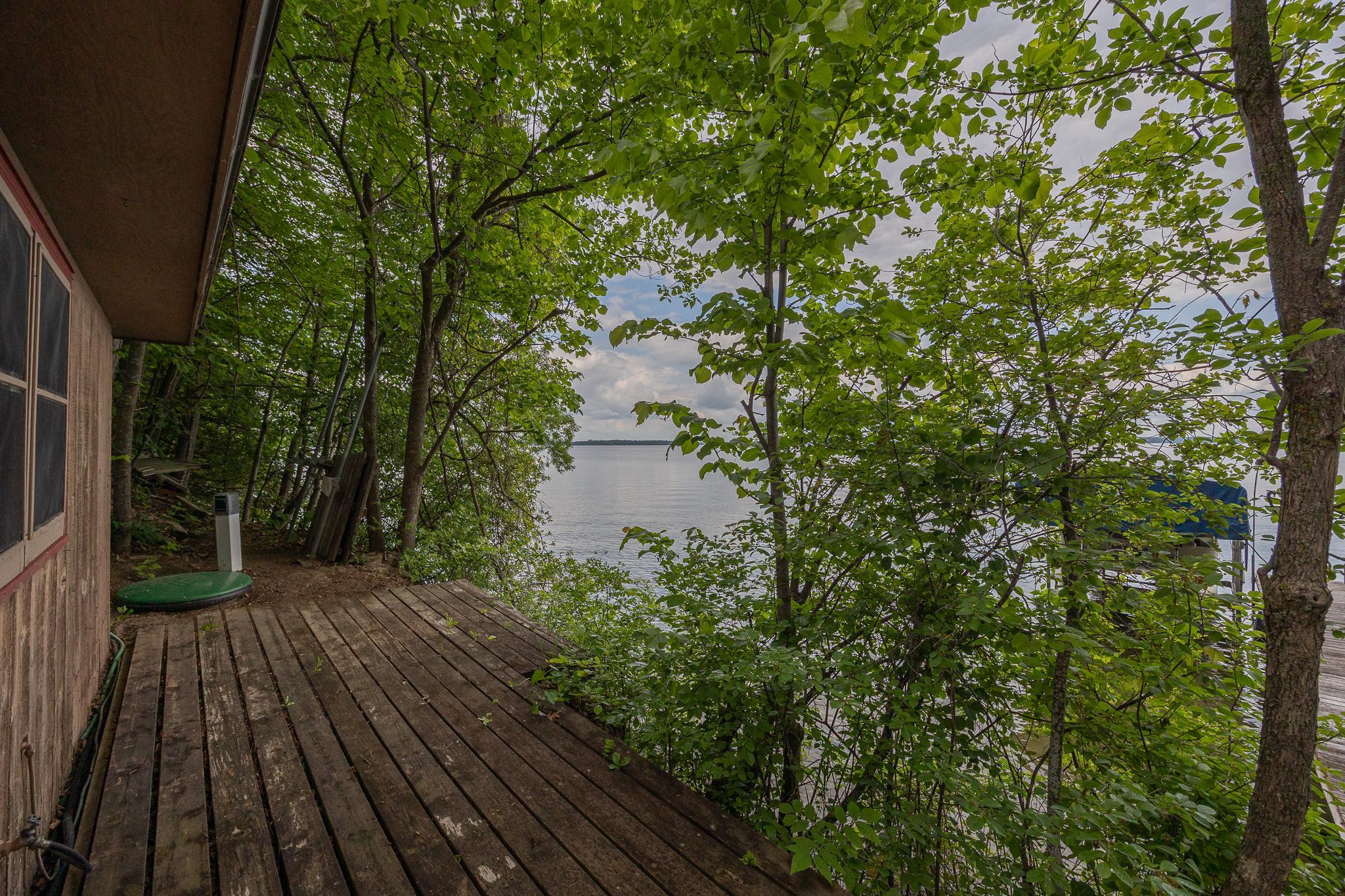 Small lakeside deck off bunkhouse.