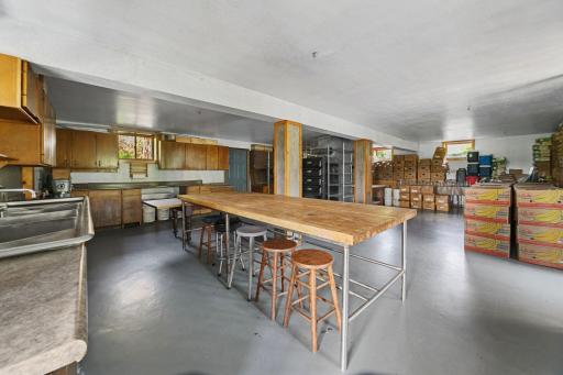 Lower-level Kitchen. All surfaces were finished in a manner that made this a licensed commercial bakery. The wood-fuled oven is severed from the sale.