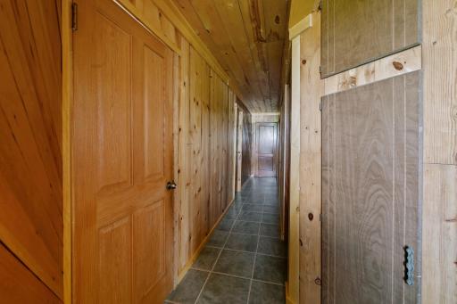 Upper-level hallway to all bedrooms and storage spaces.