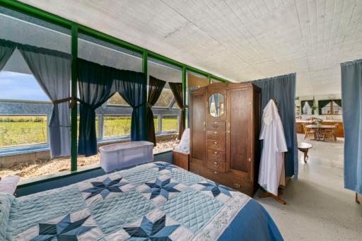 Attached greenhouse extends to sleeping area.