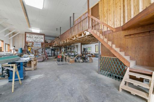 Suspended partition offers storage and room to move on the main level.