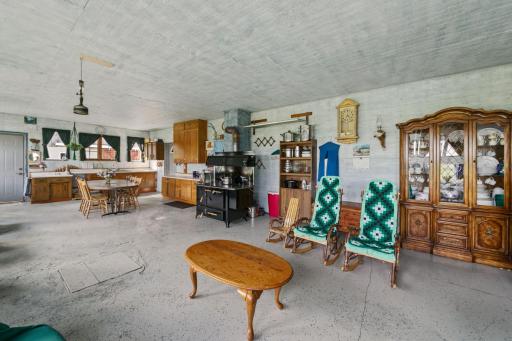 Reverse angle of living space. Wood stove will likely be severed, and replaced by a different wood stove.