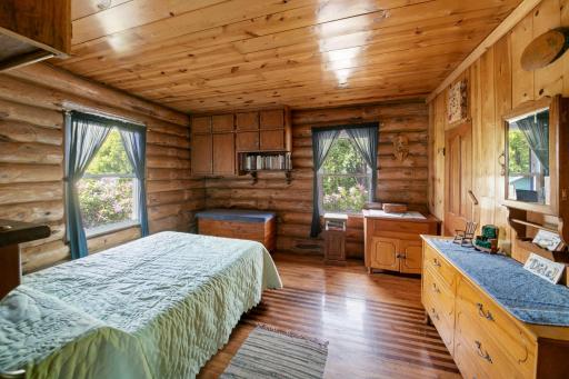Main floor bedroom. Built-in cabinets make the room versatile for either sleeping quarters or for an office.