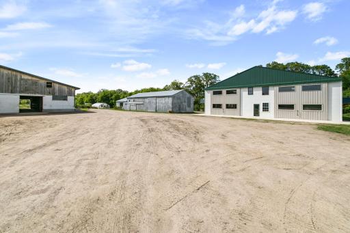 Second house on left. Storage shed with dirt floor in the middle. Heated and insulated shop on the right.