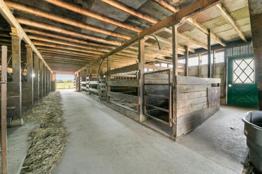 Cattle Stalls. There is also a double vented root cellar on the South Wall of the barn.