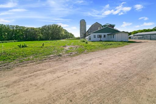 East side of second house with the barn in the background and part of South grove.