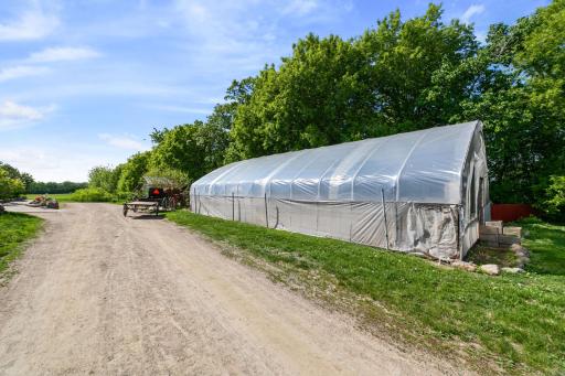 Closer view of greenhouse. Plastic covering is near the end of its service life. Still shedding water, but will need replacing.