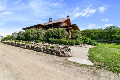 Closer look at Northwest corner of house. Lots of greenery. Flowers will soon bloom!