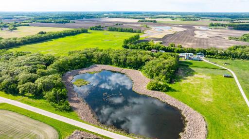 Most of Parcel. 120 acres "L-Shaped", mixed pasture/tillable, heavily wooded, building site, and pond.
