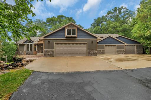 This exquisite home is nestled on over four acres, set back from the road creating a private oasis.
