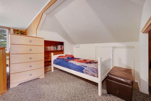 There is unused/unfinished crawl space beyond the bed in this nook, would be perfect for additional storage.