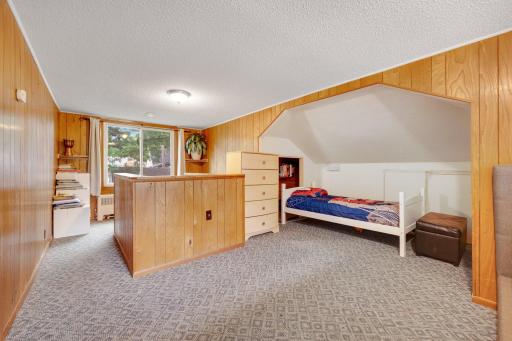 This room is currently being used as the primary bedroom with space for a child in the nook. This could easily be a flex space if you choose not to use it as a bedroom!