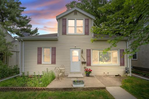 Charming one-and-a-half-story with curb appeal and a cozy front patio that welcomes you home!