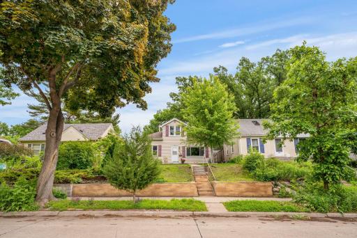 Elevated curb appeal and a leafy canopy of mature trees. Detached two stall garage around the back!