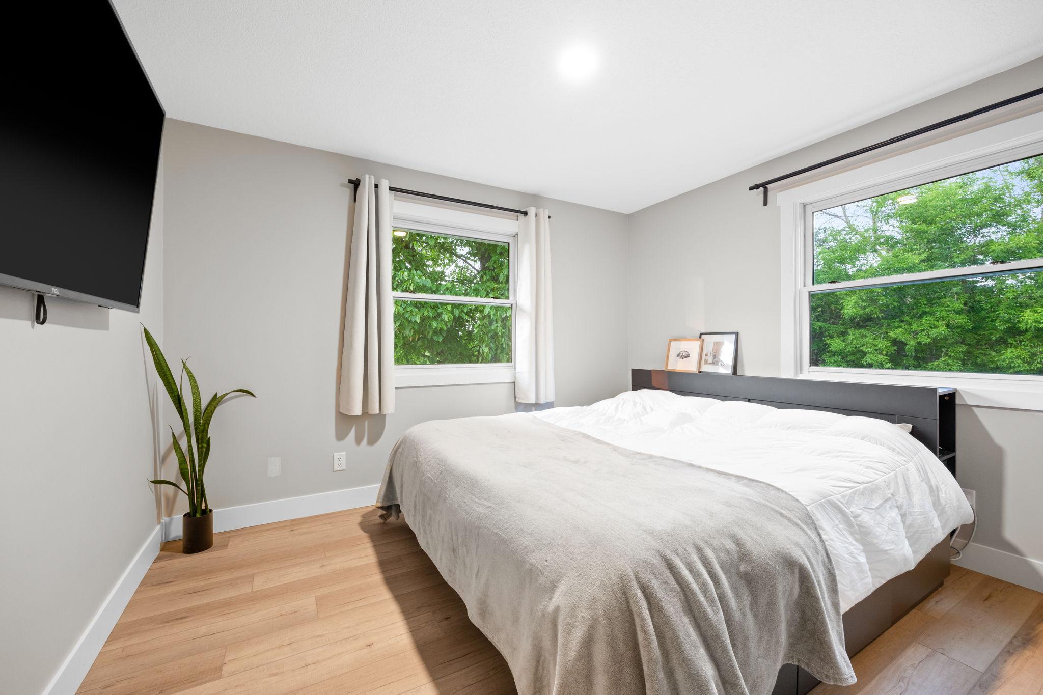 Main level primary bedroom with closet organization system.