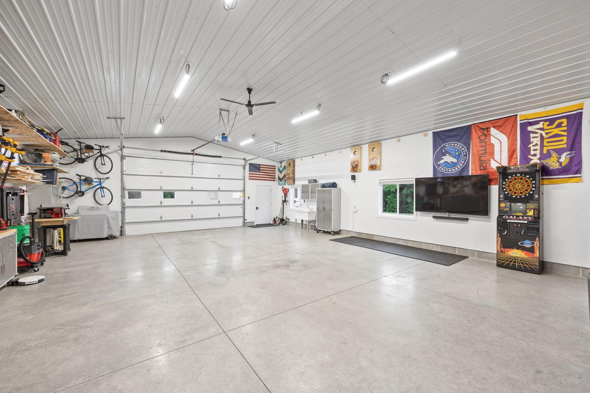 11’ side walls & 10’ garage door, water supply, heat/AC. Shop is used year around.